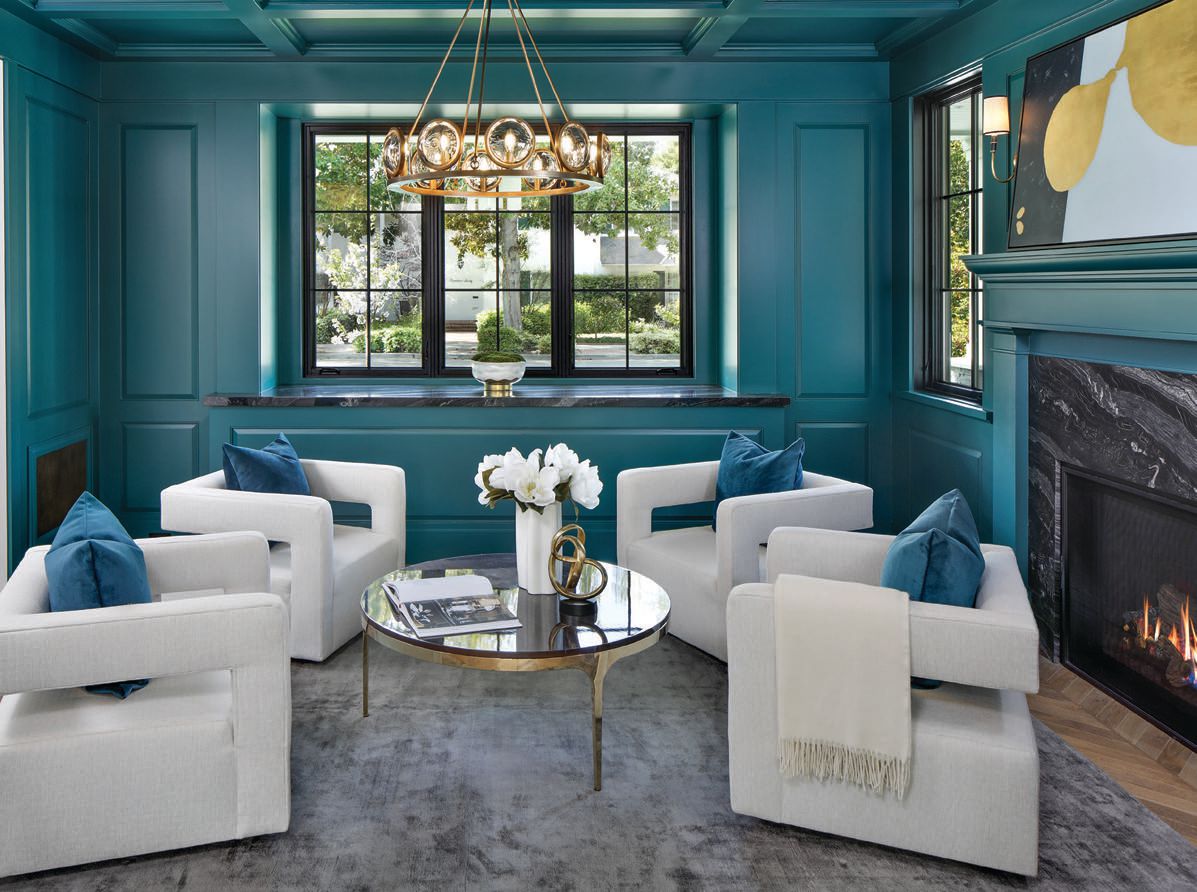 The parlor features a coffered ceiling and paneled walls finished in a rich, blue-green hue. PHOTO BY BERNARD ANDRE/COURTESY OF YOUNG PLATINUM GROUP (GOLDEN GATE SOTHEBY’S INTERNATIONAL REALTY)