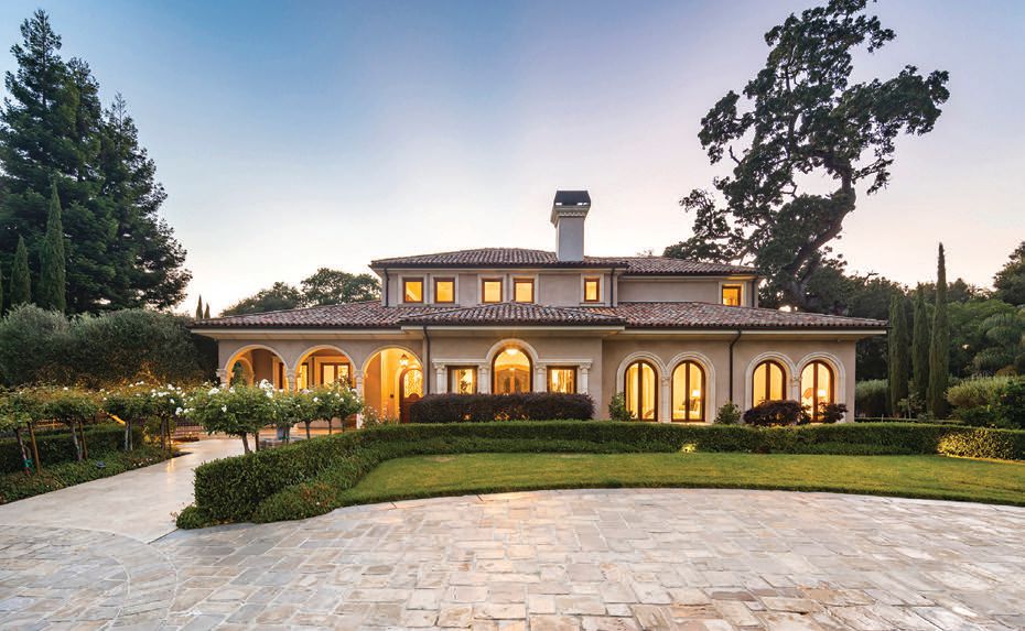 The 14,685-square-foot home features a Tuscan-style exterior. PHOTO BY JAY REASON AND ZACHARY KINOVSKY/DELEON REALTY