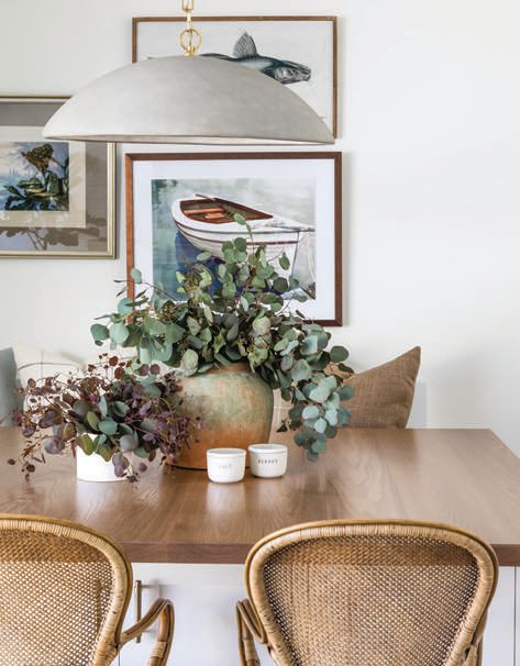 A cozy dining nook in the casita is accented with eucalyptus leaves. PHOTOGRAPHED BY VANESSA LENTINE