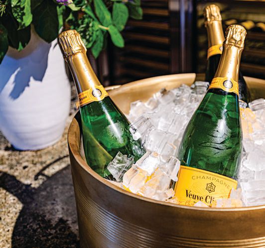 The new Veuve Clicquot Terrasse takes place in the property’s 2,000-square-foot courtyard CHEF PHOTO COURTESY OF GREENS AND MELA BISTRO