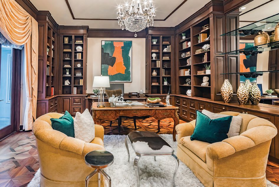 A spacious, light-filled office and library showcase exquisite molding. PHOTO BY BY JAY REASON /DELEON REALTY