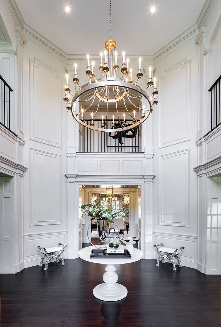 The grand foyer of this Atherton home showcases gorgeous millwork PHOTO BY: ZACHARY KINOVSKY & JAY REASON