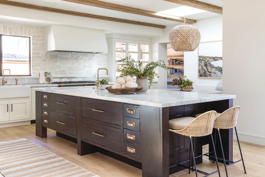 Also in the main house, custom cabinetry and stone are accented with Ashley Norton hardware. PHOTOGRAPHED BY VANESSA LENTINE