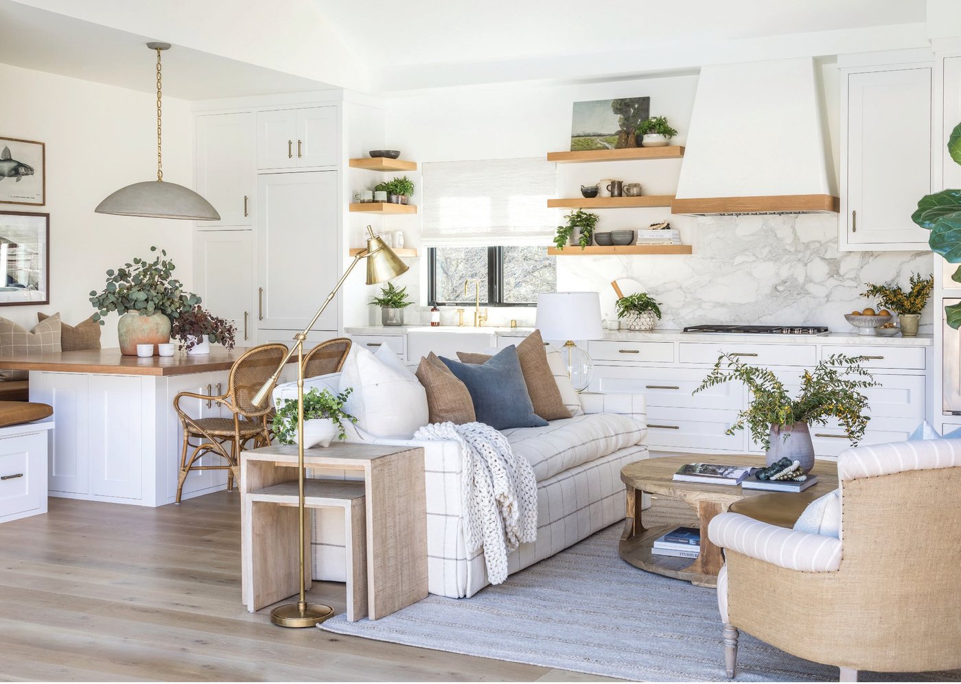 In the casita great room of San Francisco 49ers President Al Guido’s family home in Los Gatos, Aly Morford and Leigh Lincoln of Pure Salt Interiors pulled items from their shop, including the Elliot pendant, Merwin side tables, the Raymond armchair and the Elm coffee table.PHOTOGRAPHED BY VANESSA LENTINE
